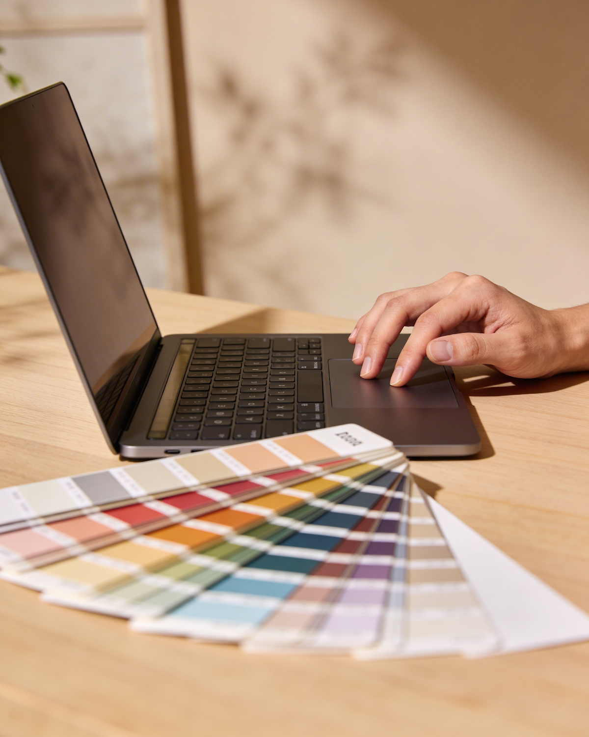 A person focused on a laptop screen, actively creating a new Pin with an engaging image and relevant details for affiliate marketing.