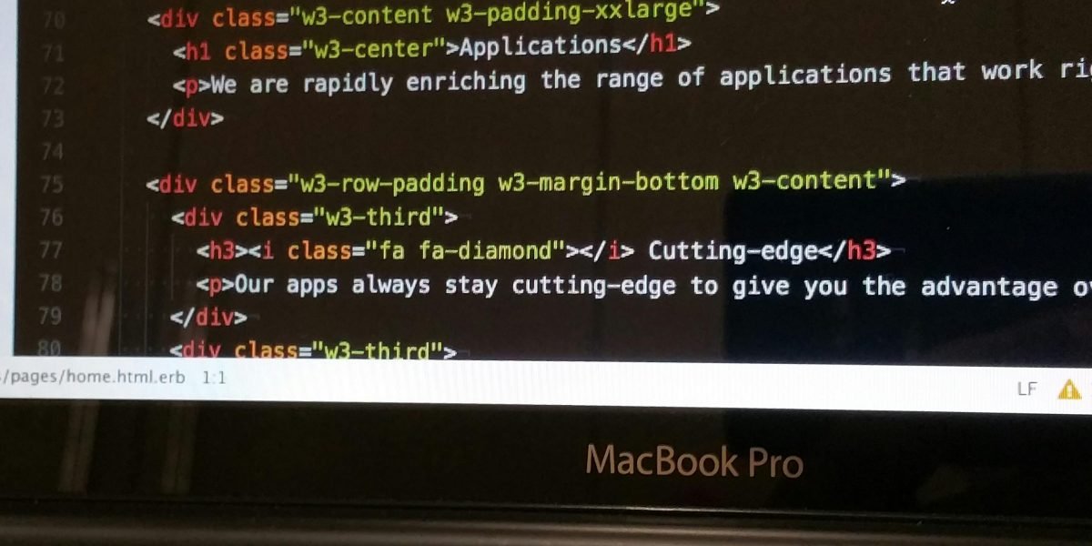 A person focused on data analysis on multiple screens, representing the critical steps of tracking, optimizing, and scaling an affiliate business.