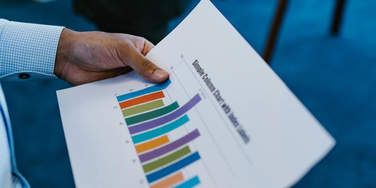 An individual reviewing documents, symbolizing the use of advanced tracking and reporting for smarter decisions.
