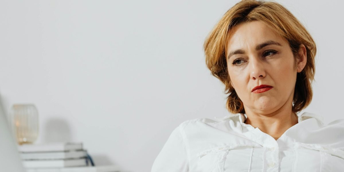 A business professional looks thoughtful, symbolizing the complexities of managing affiliate programs.