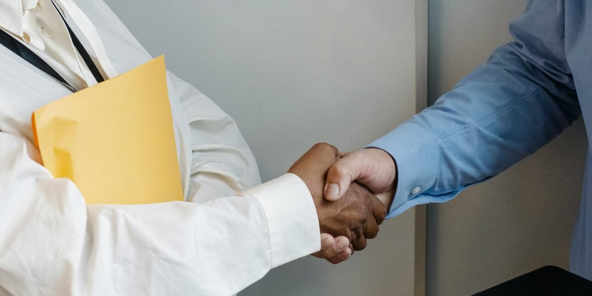 Professionals shaking hands, representing building trust and strong partnerships in business.