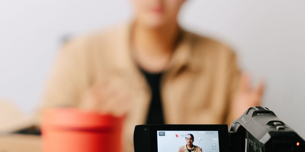 A content creator filming a product review, demonstrating authenticity and engaging their audience.