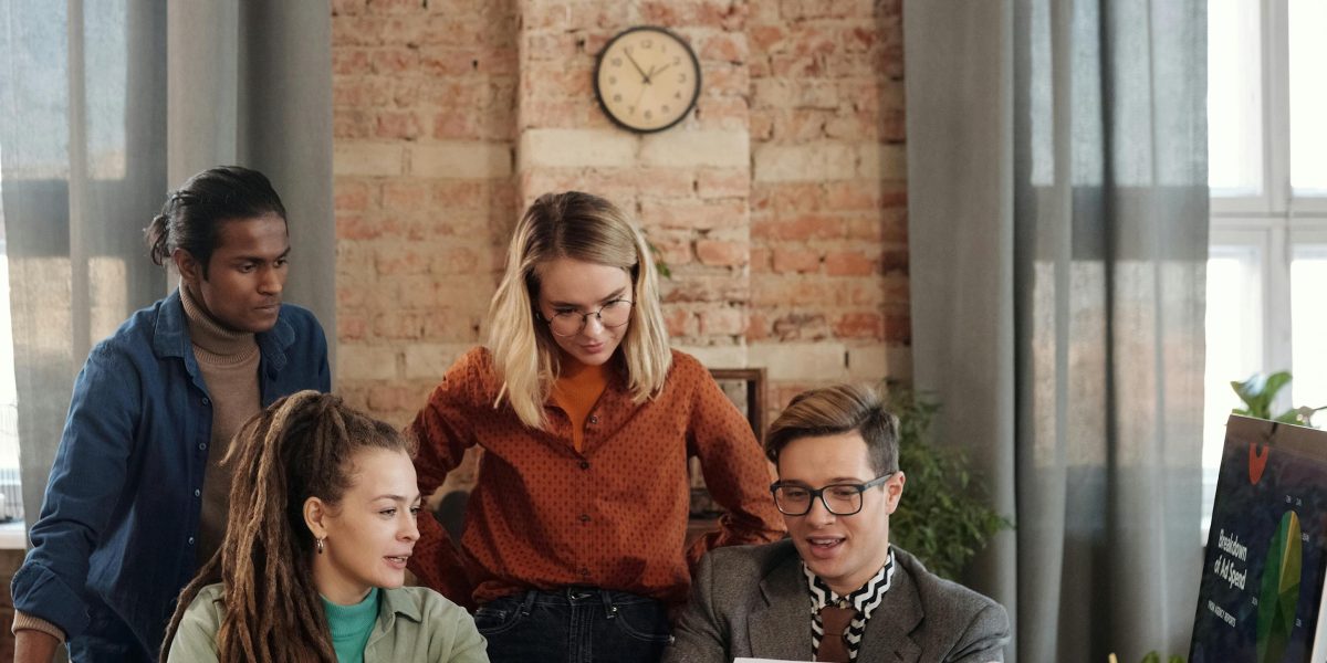 A team collaborating to scale their marketing efforts, representing the simplified management offered by affiliate networks.