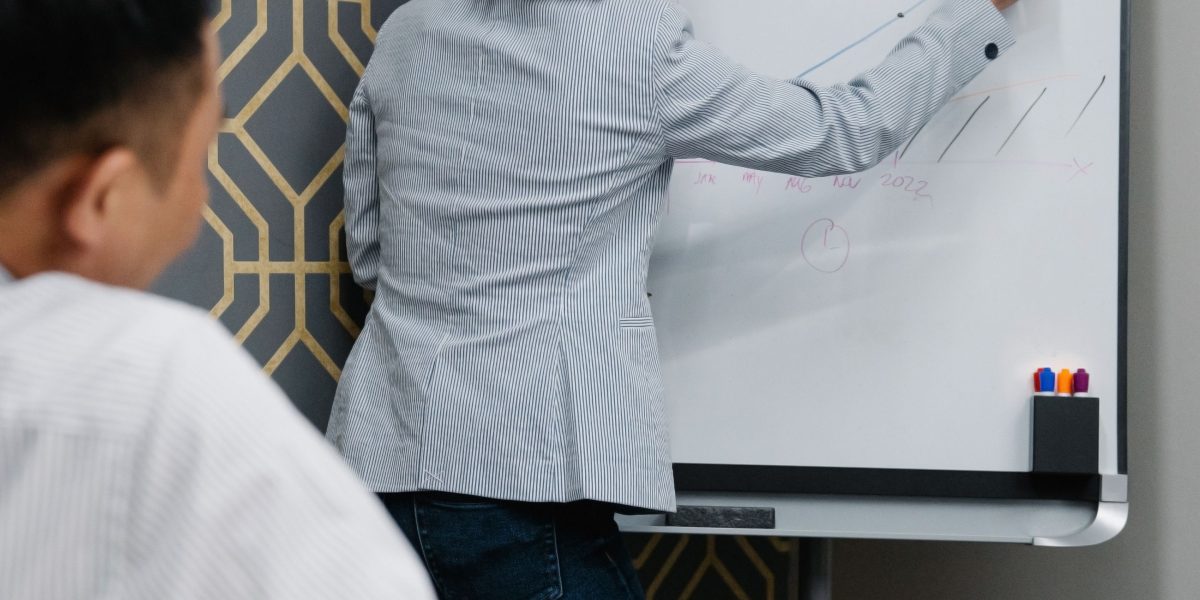 An individual thoughtfully planning their strategy to achieve their streaming goals.