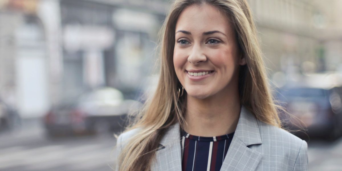 A confident entrepreneur smiles, ready to seize market opportunities.
