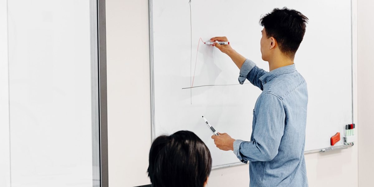 A person actively planning and mapping out their strategy, reflecting the commitment needed for affiliate success.