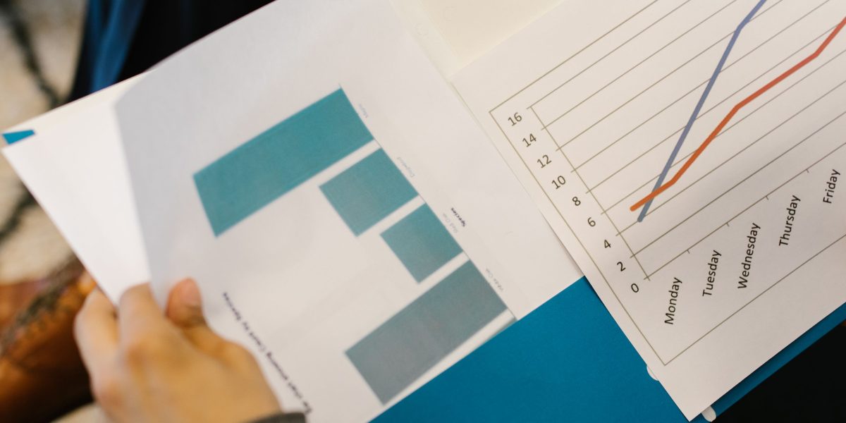 A person reviewing financial reports, symbolizing the clarity KP affiliate links provide.