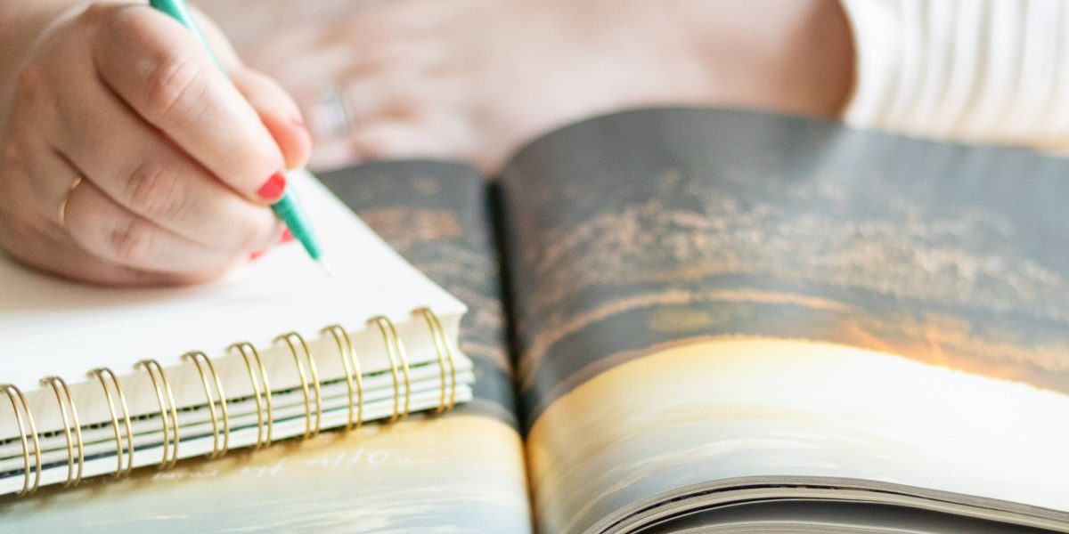 Someone actively planning and strategizing content, a core activity for successful affiliate marketing.