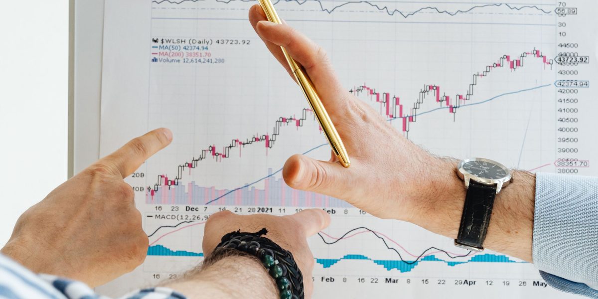 A focused individual reviewing reports or data on a whiteboard, symbolizing the process of testing and troubleshooting technical setups.