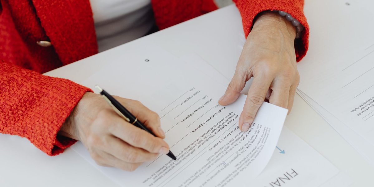 An individual carefully examining legal documents, reflecting the importance of compliance and disclosures in affiliate marketing.