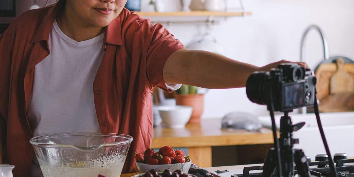 A content creator meticulously plans and records a video, leveraging visual storytelling to engage their audience.