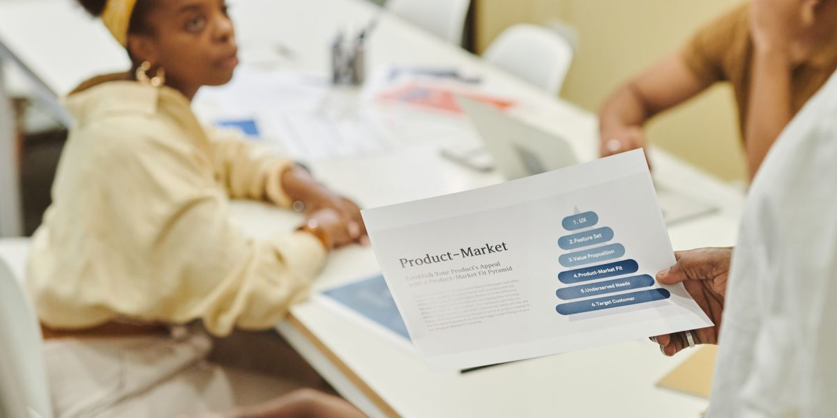 Two business partners engaged in a focused discussion, symbolizing the strategic thinking required for long-term growth and effective affiliate program management.
